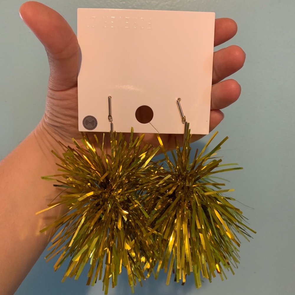 Gold Pom Pom earrings.